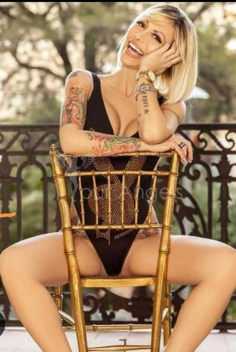 blonde escort girl with tattoos